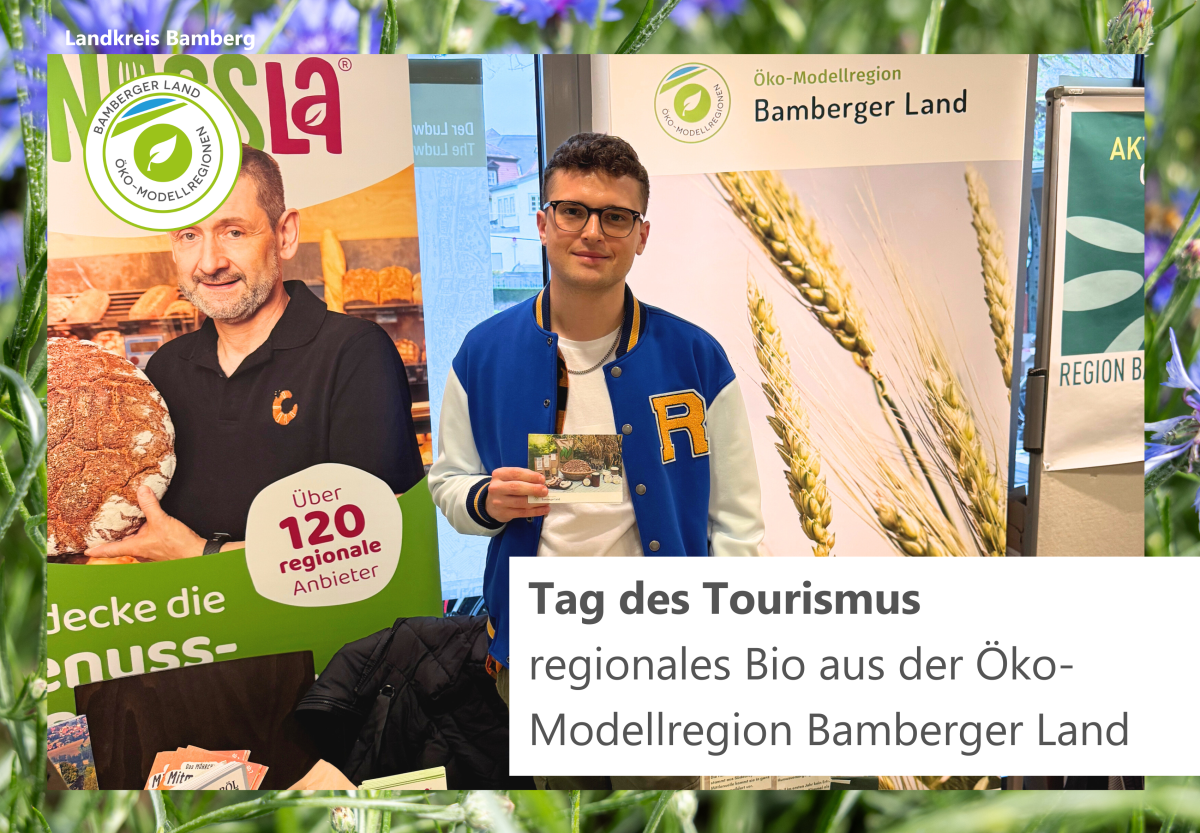 Infostand der Öko-Modellregion mit Personen