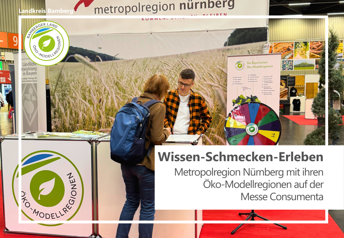 Infostand der Öko-Modellregion mit Personen