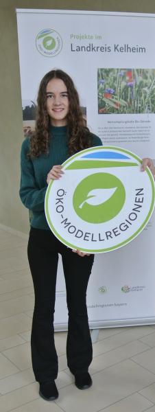 Foto Frau mit Schild
