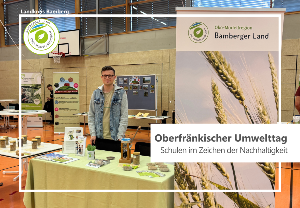 Infostand der Öko-Modellregion mit Personen